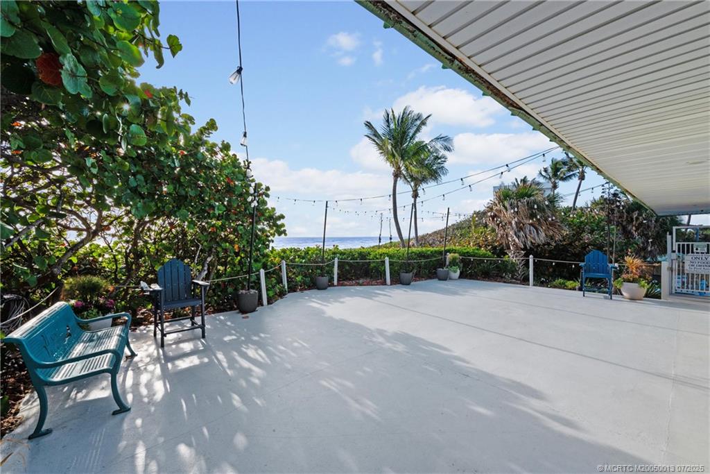 Undisclosed Address Jensen Beach, FL 34957 - Photo 39 of 47 a view of a patio with table and chairs and potted plants