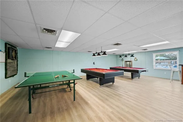 an aerial view of a houses with a lake view