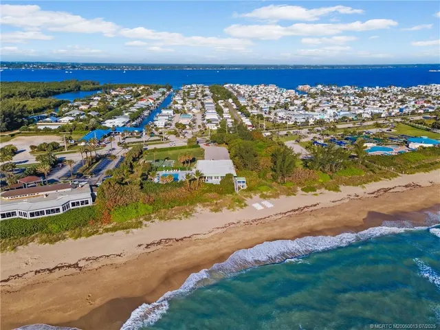a view of a yard with an ocean view