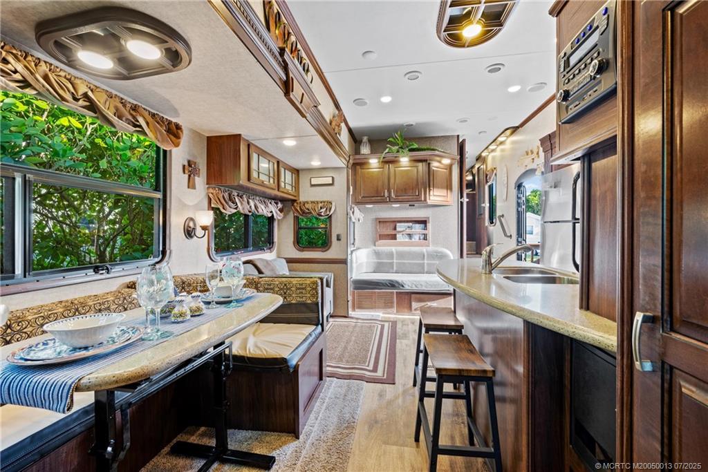 Undisclosed Address Jensen Beach, FL 34957 - Photo 7 of 47 a view of a dining room with furniture window and outside view