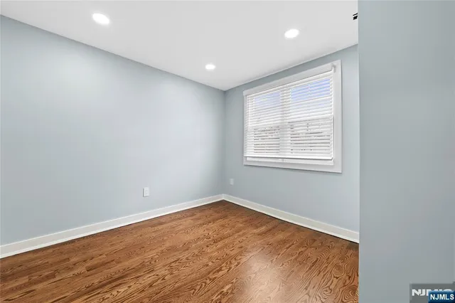a bathroom with a sink a mirror and a shower