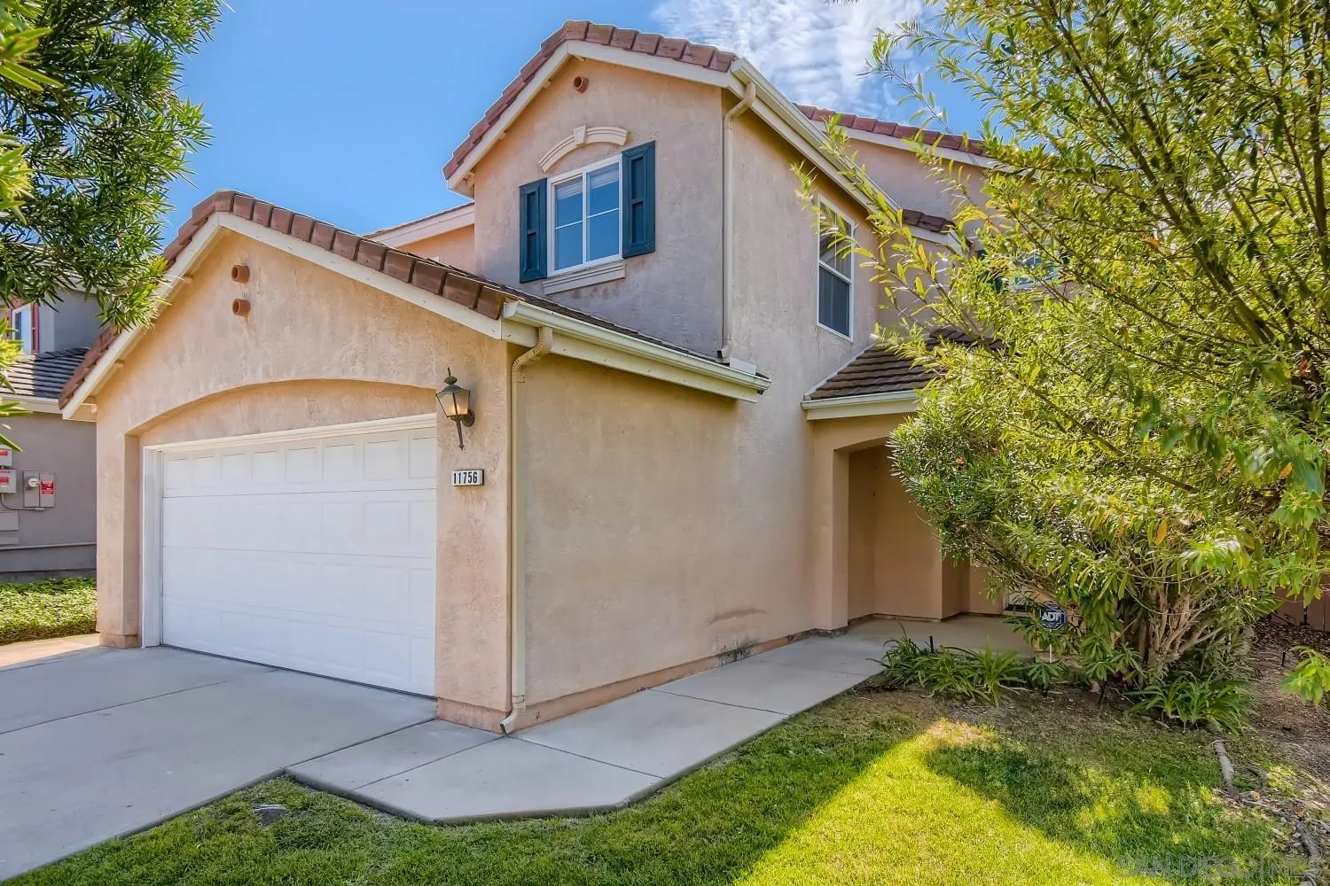 11756 Pickford Road San Diego, CA 92131 - Photo 2 of 26 a view of a house with a yard