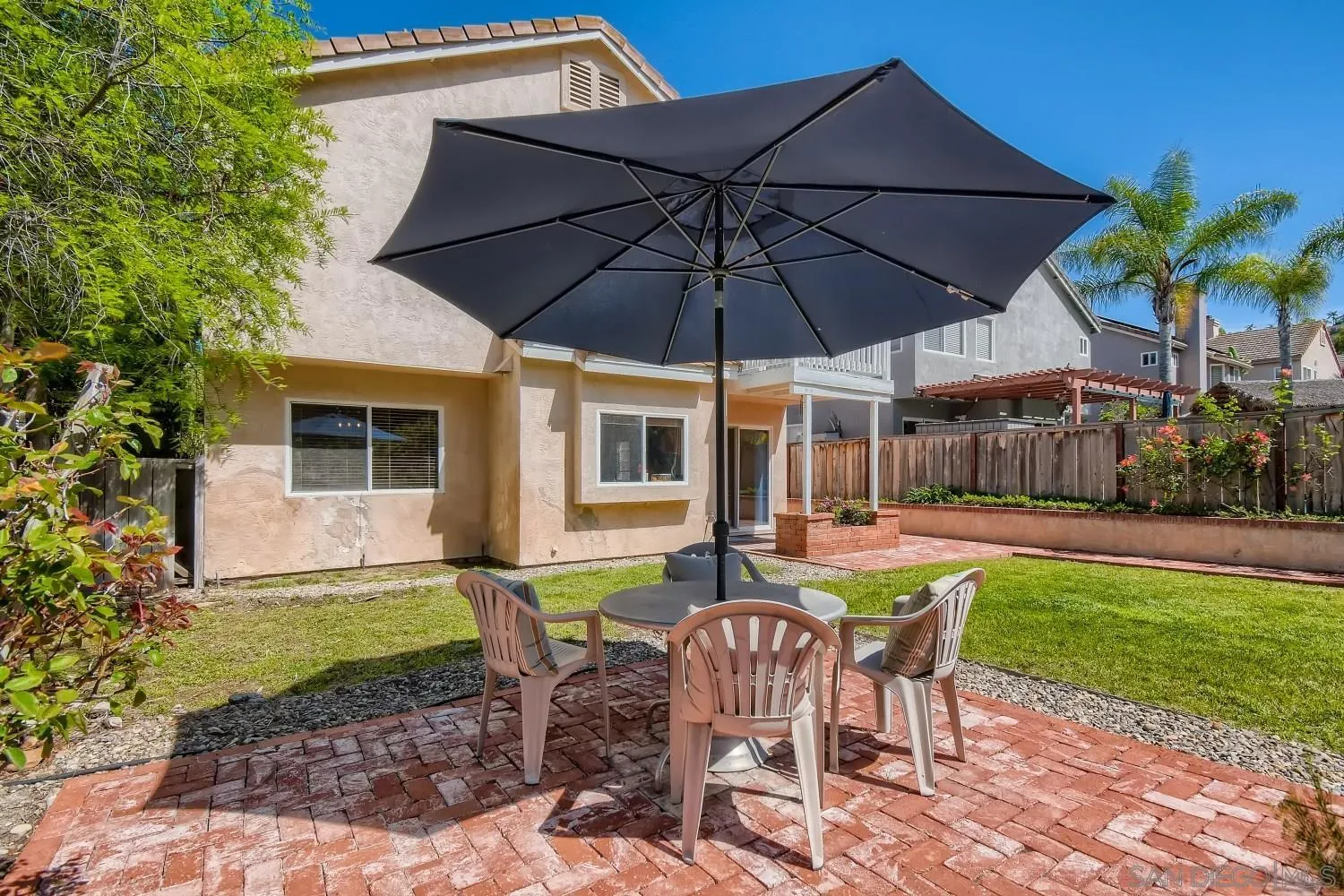 11756 Pickford Road San Diego, CA 92131 - Photo 22 of 26 a view of a house with backyard sitting area and garden