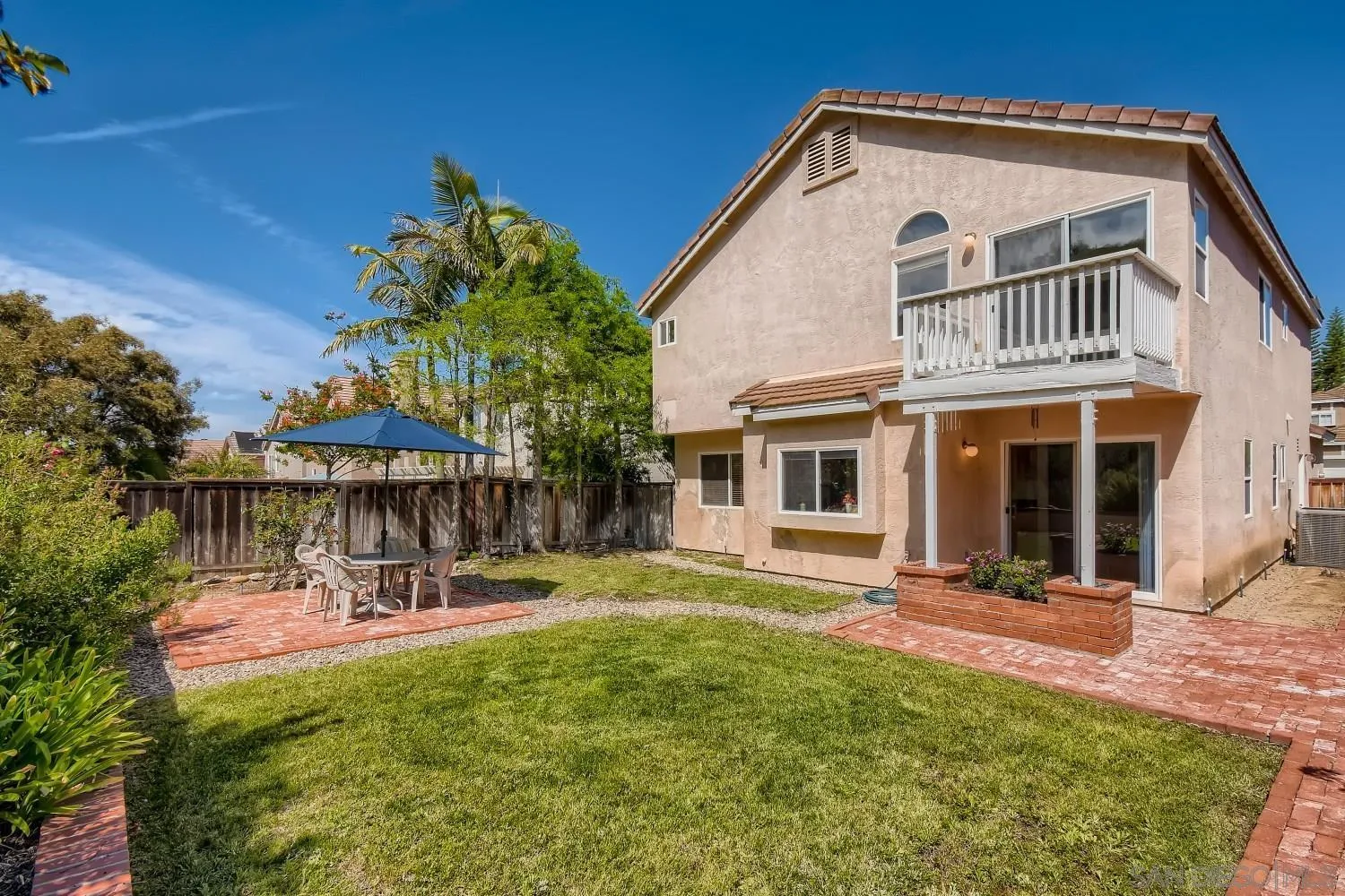 11756 Pickford Road San Diego, CA 92131 - Photo 24 of 26 a view of a house with a yard porch and sitting area
