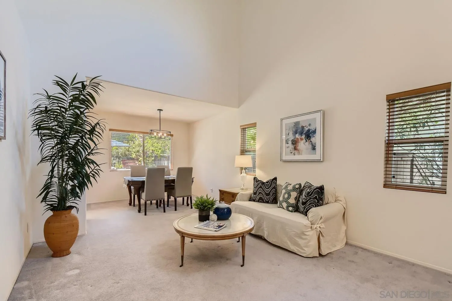11756 Pickford Road San Diego, CA 92131 - Photo 3 of 26 a living room with furniture and a potted plant