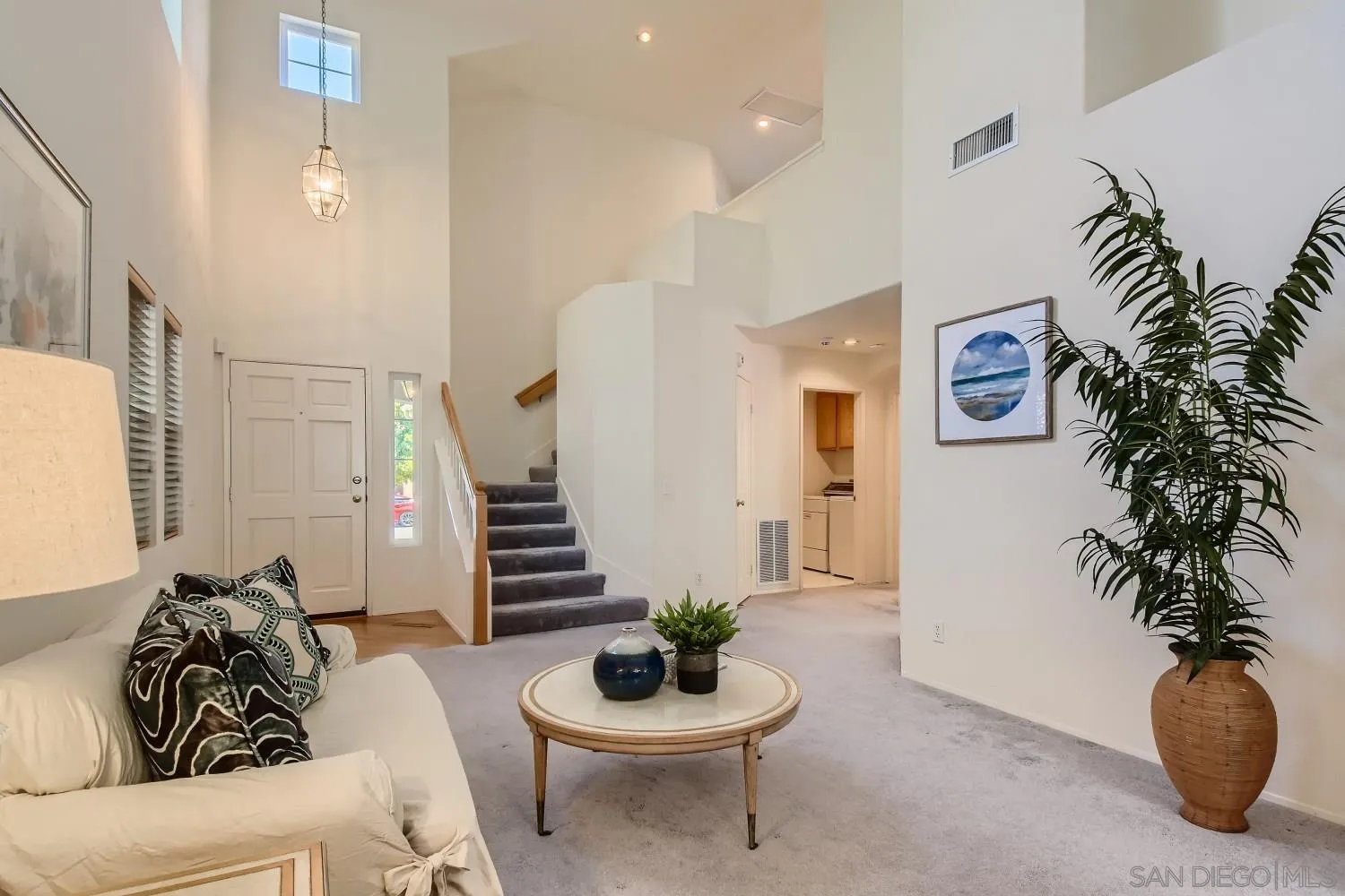 11756 Pickford Road San Diego, CA 92131 - Photo 4 of 26 a living room with furniture and a potted plant