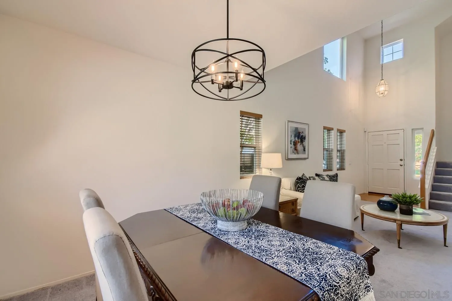 11756 Pickford Road San Diego, CA 92131 - Photo 5 of 26 a living room with furniture a window and wall paintings