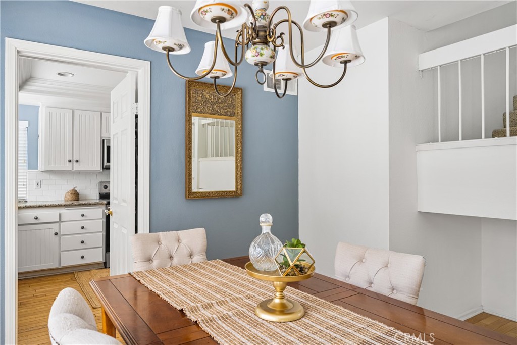 10 Brookstone Avenue Irvine, CA 92604 - Photo 19 of 67 a bedroom with a bed and chandelier