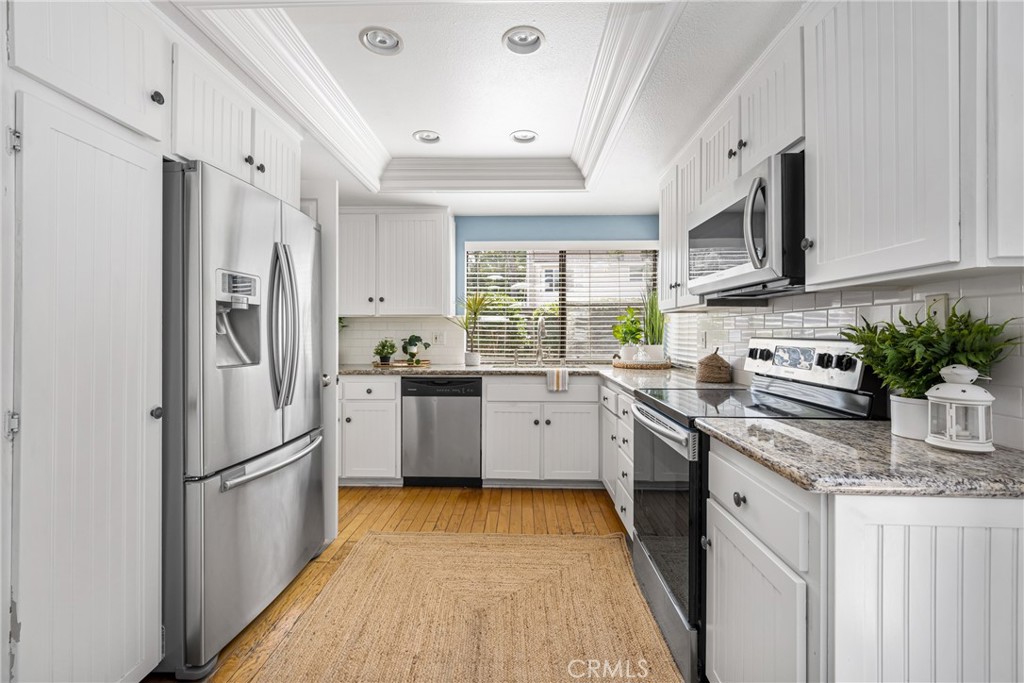 10 Brookstone Avenue Irvine, CA 92604 - Photo 24 of 67 View of kitchen from the Family Room