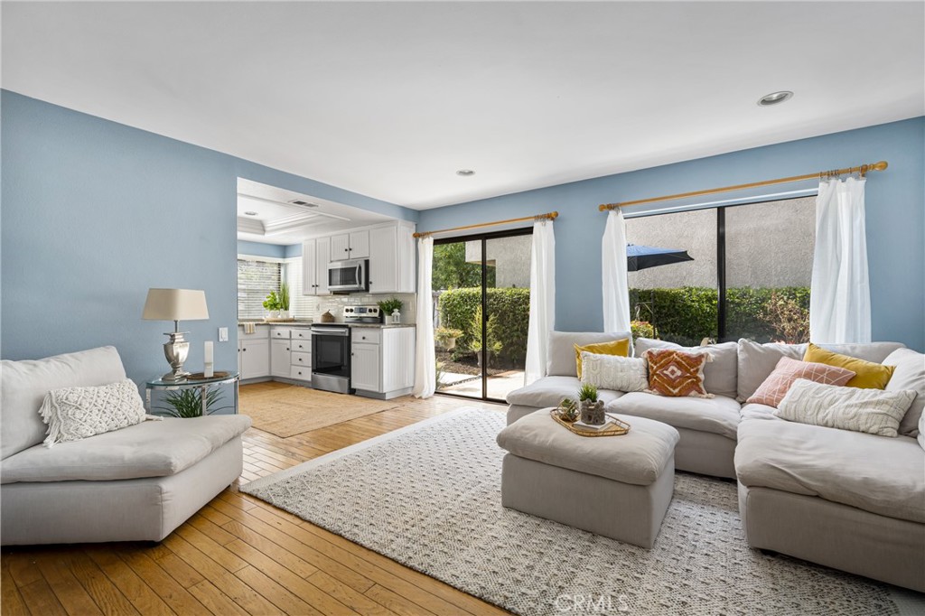 10 Brookstone Avenue Irvine, CA 92604 - Photo 25 of 67 a living room with furniture and large windows