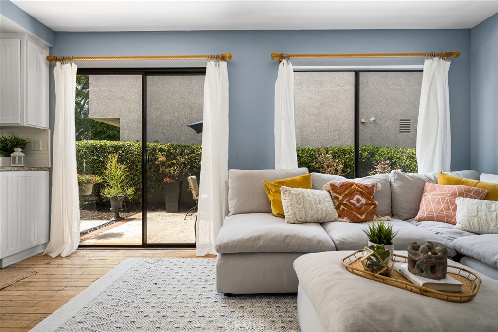10 Brookstone Avenue Irvine, CA 92604 - Photo 26 of 67 a living room with furniture and a potted plant