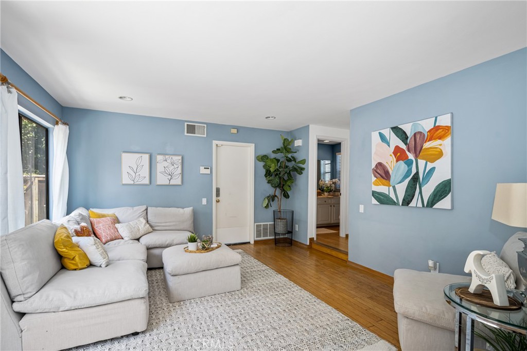 10 Brookstone Avenue Irvine, CA 92604 - Photo 27 of 67 a living room with furniture and painting on the wall