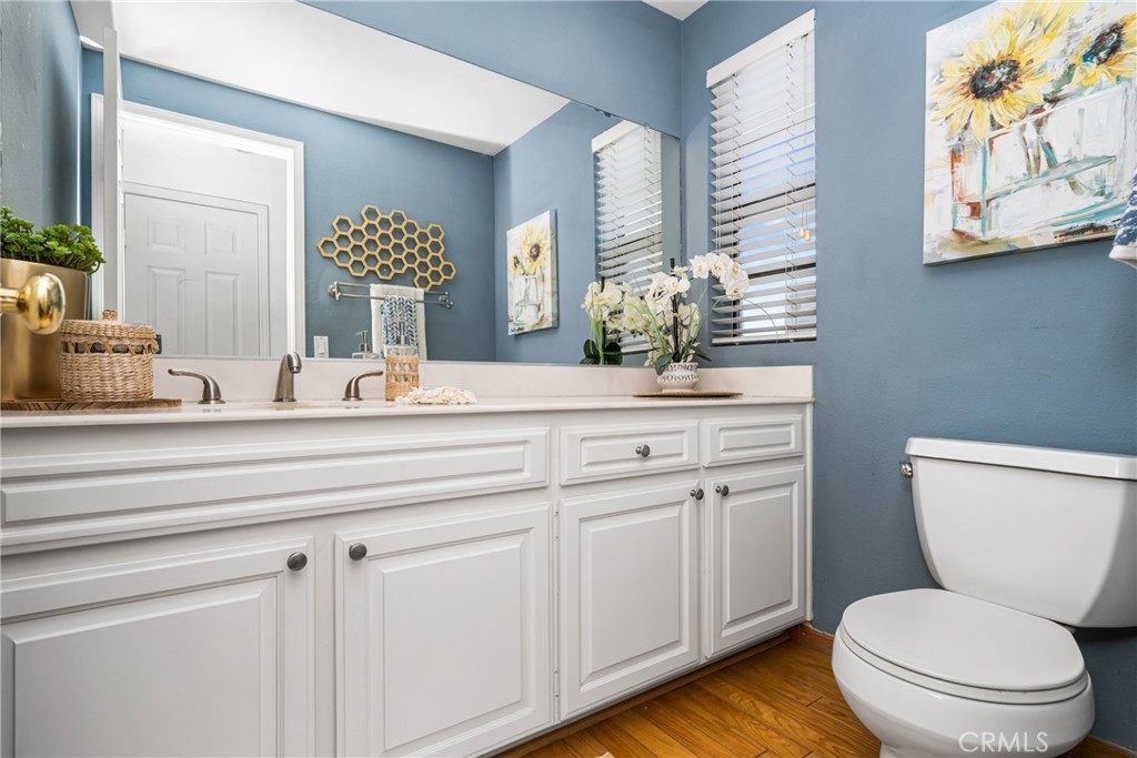 10 Brookstone Avenue Irvine, CA 92604 - Photo 30 of 67 a bathroom with a toilet sink and mirror