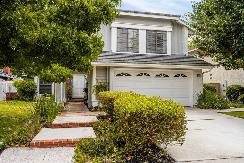 10 Brookstone Avenue Irvine, CA 92604 - Photo 4 of 67 a front view of a house with a yard