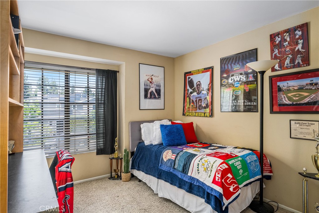 10 Brookstone Avenue Irvine, CA 92604 - Photo 41 of 67 a bedroom with a bed and wooden floor