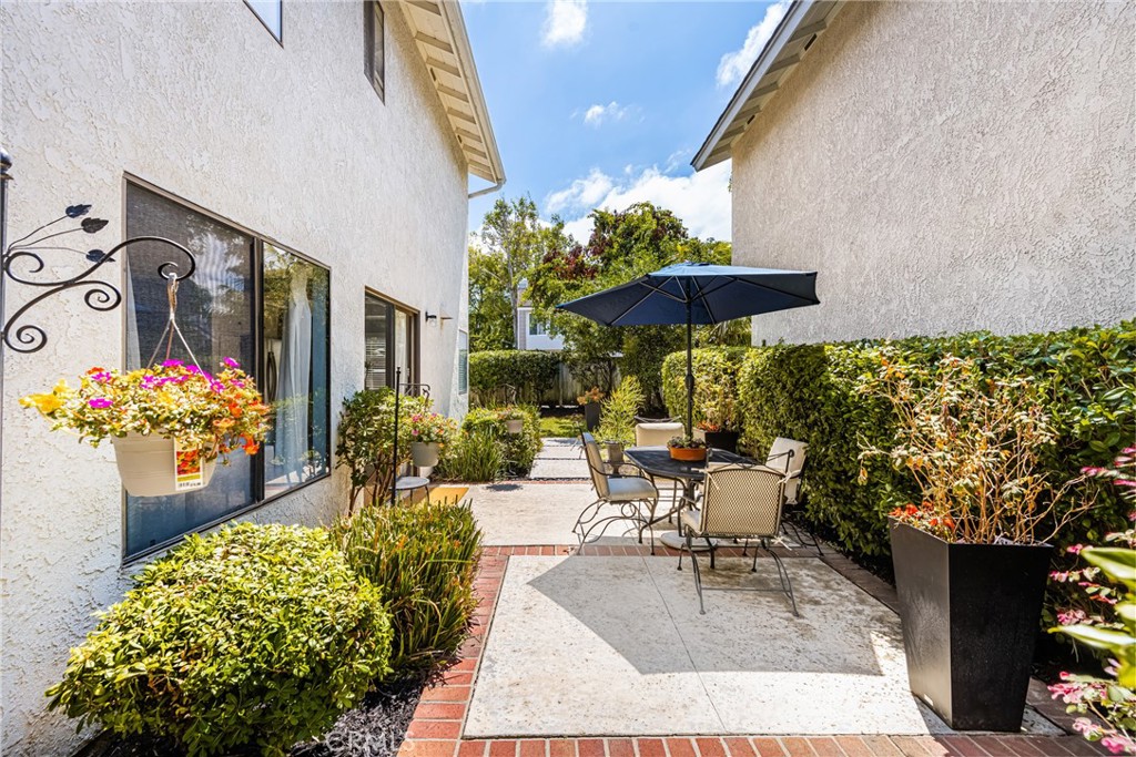 10 Brookstone Avenue Irvine, CA 92604 - Photo 45 of 67 a view of a chairs and table in backyard