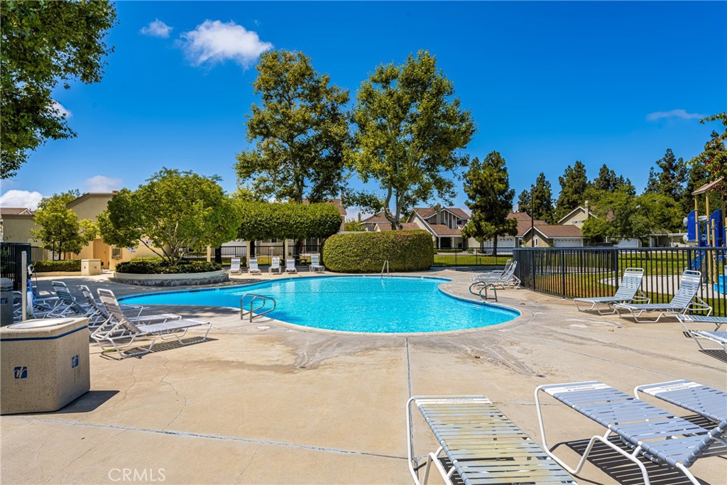 10 Brookstone Avenue Irvine, CA 92604 - Photo 57 of 67 a view of a swimming pool with a patio and a yard