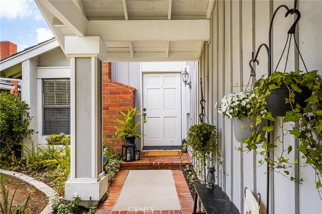 10 Brookstone Avenue Irvine, CA 92604 - Photo 6 of 67 a potted plant sitting in front of a house