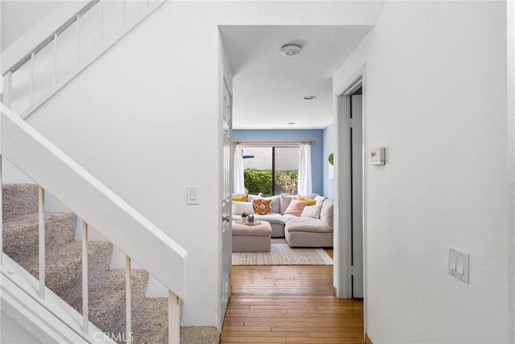 10 Brookstone Avenue Irvine, CA 92604 - Photo 10 of 67 a living room with furniture and a wooden floor