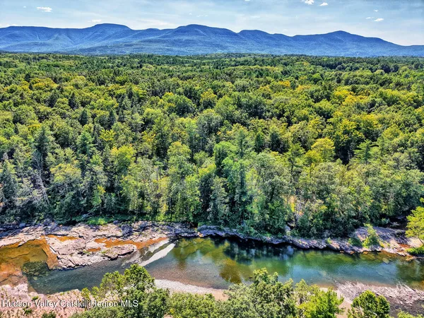 a view of lake with mountain in the background