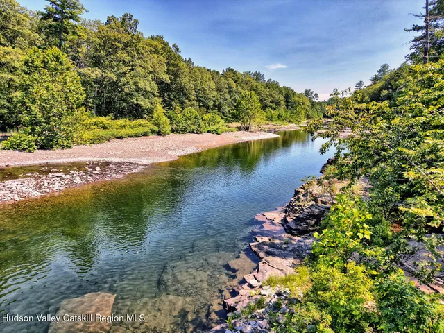a view of house with backyard