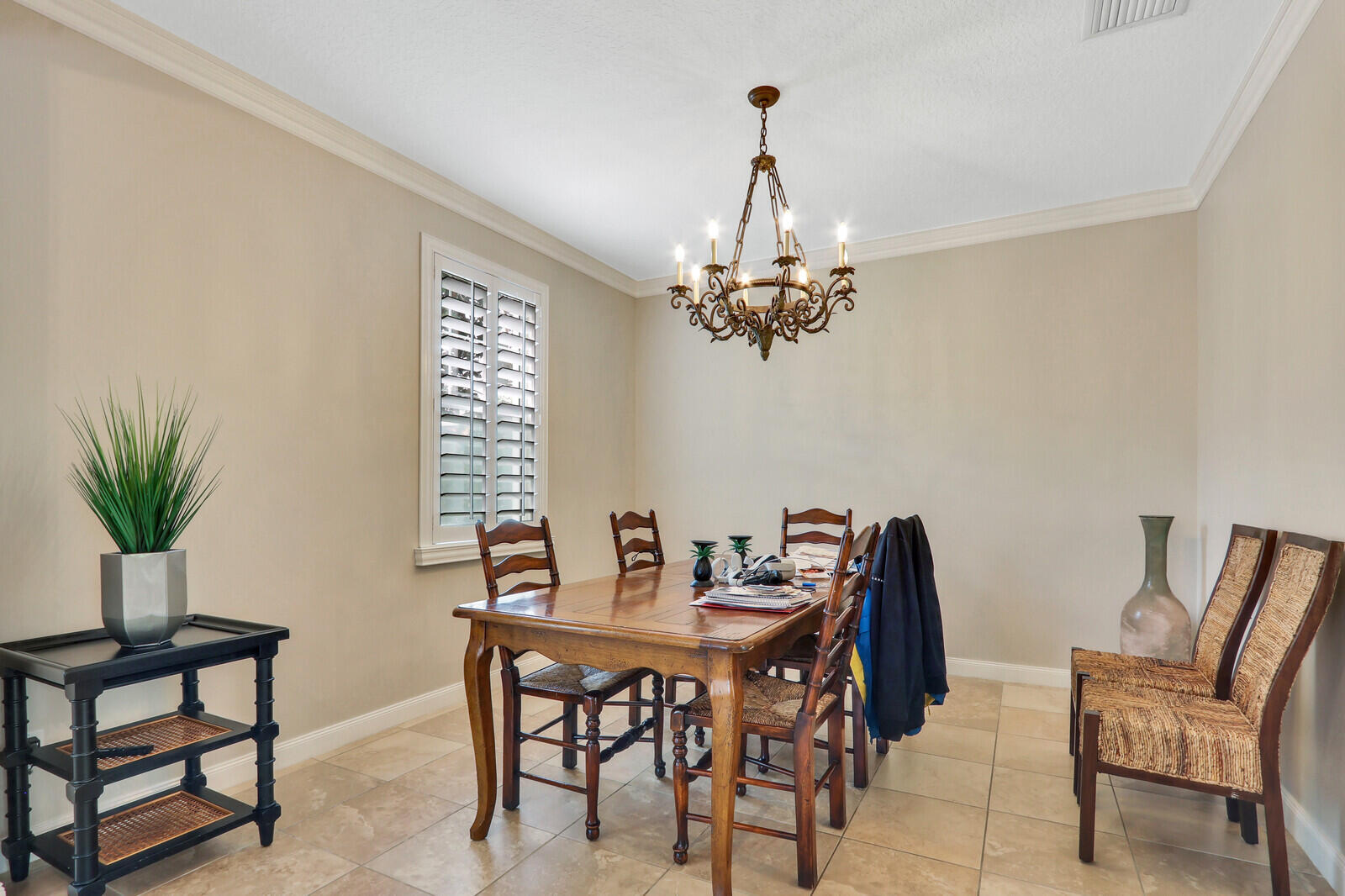 101 St Pierre Way Jupiter, FL 33458 - Photo 8 of 57 a view of a dining room with furniture and chandelier