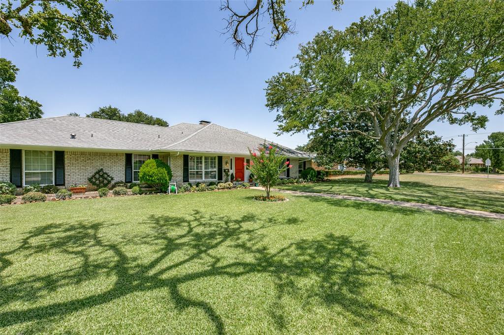 4555 Forest Bend Road Dallas, TX 75244 - Photo 1 of 1 a front view of a house with a yard