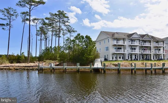 a view of a lake with a building in the background
