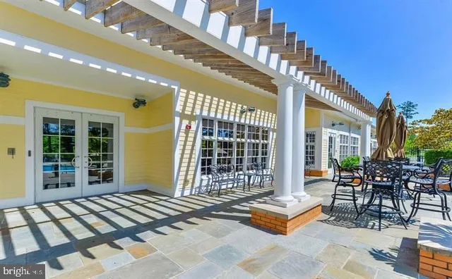 a outdoor space with lots of windows and plants