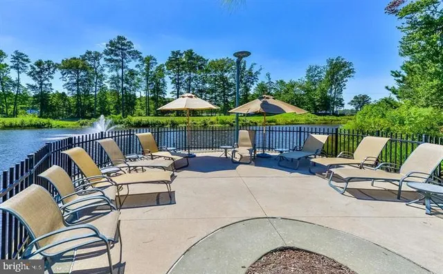 a view of patio with chairs and a table