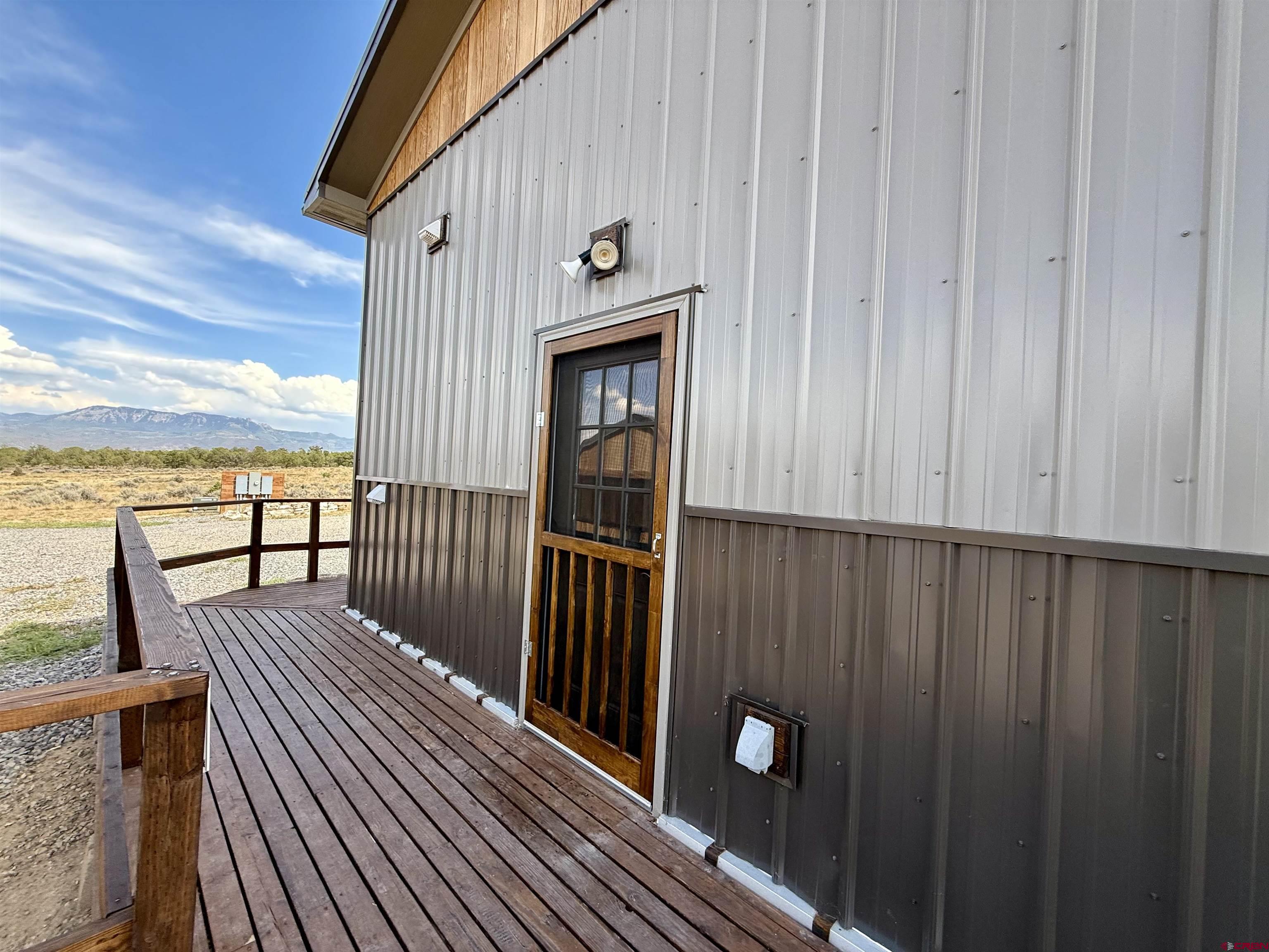 75707 B76 Road Crawford, CO 81415 - Photo 19 of 44 a view of a balcony with furniture and wooden floor