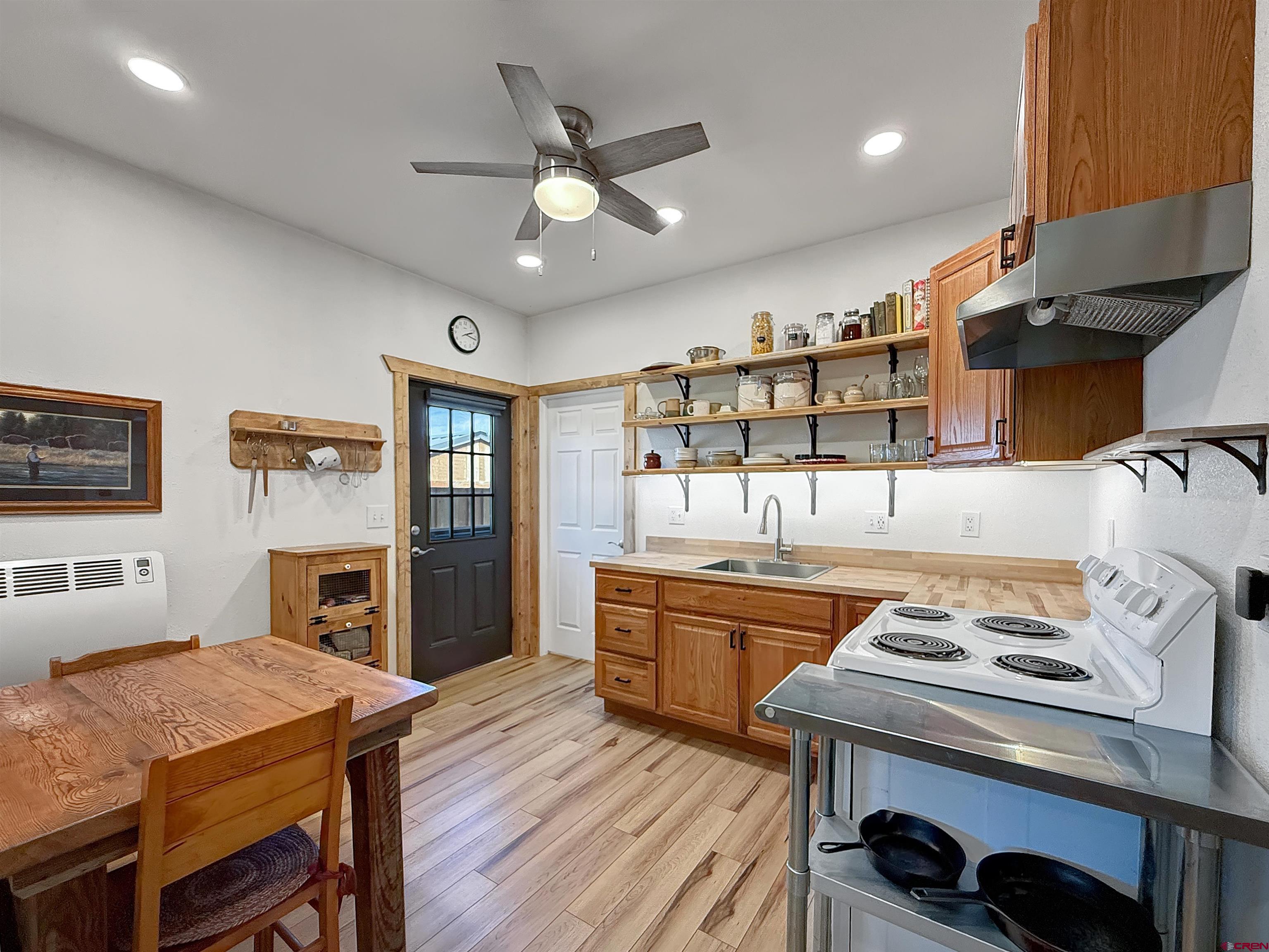 75707 B76 Road Crawford, CO 81415 - Photo 29 of 44 a kitchen with a table chairs stove and refrigerator