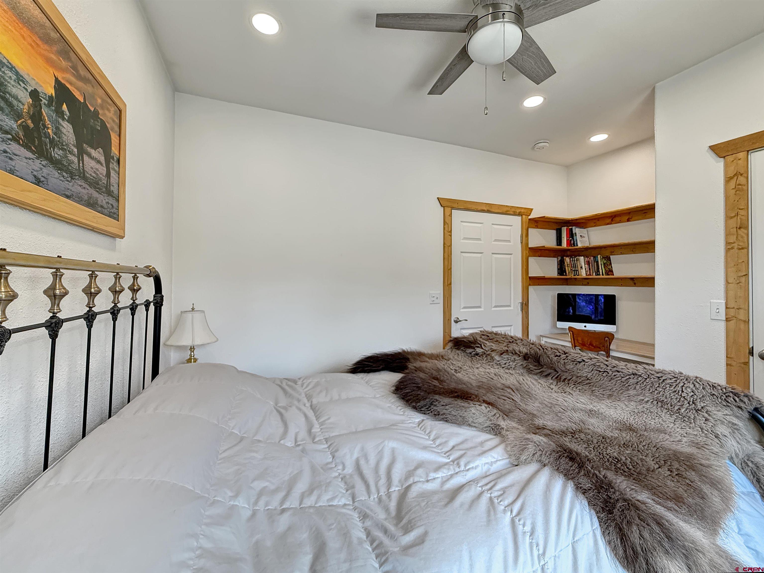 75707 B76 Road Crawford, CO 81415 - Photo 33 of 44 a bedroom with a bed and a ceiling fan
