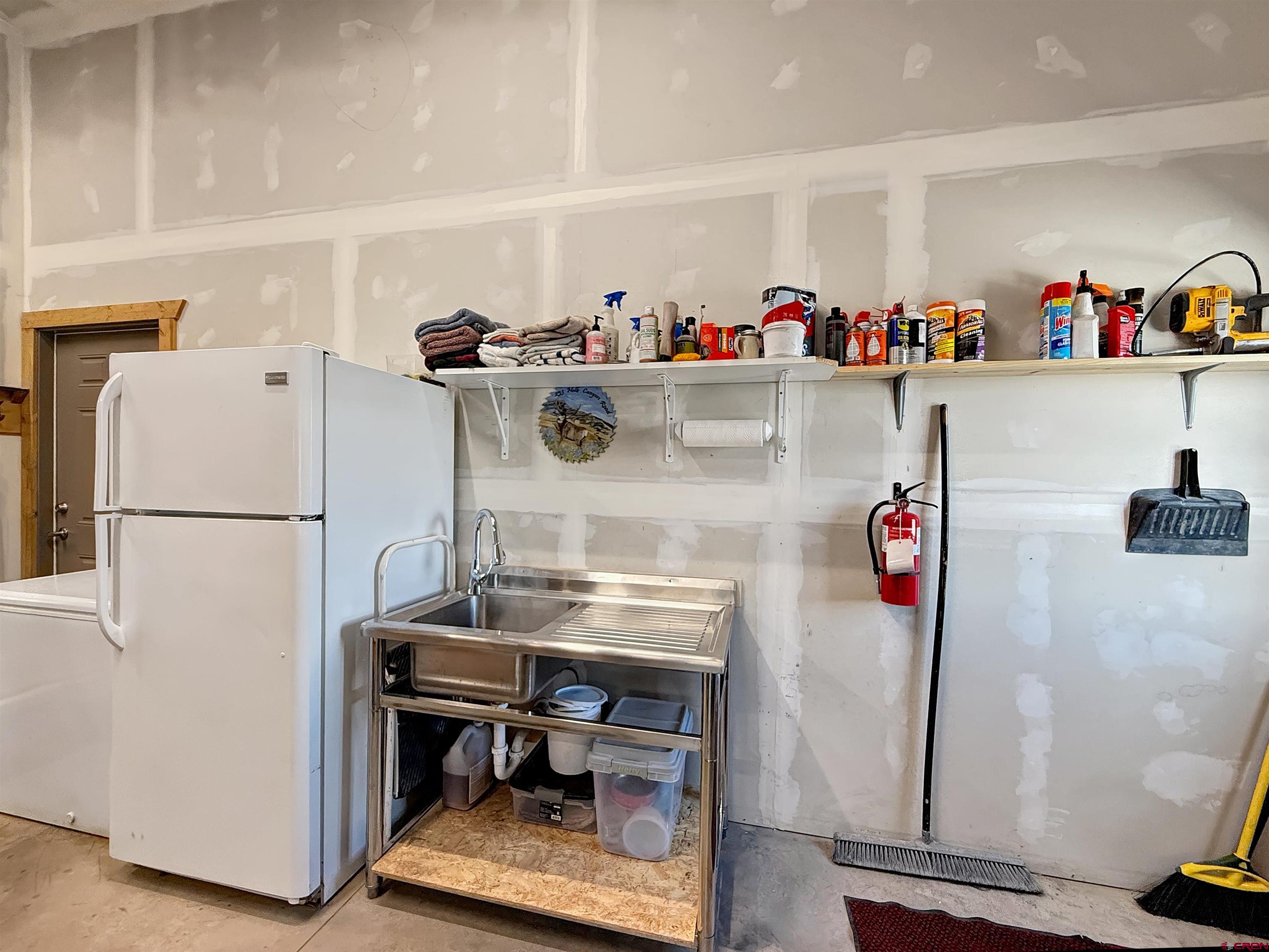 75707 B76 Road Crawford, CO 81415 - Photo 38 of 44 a room with storage and utility