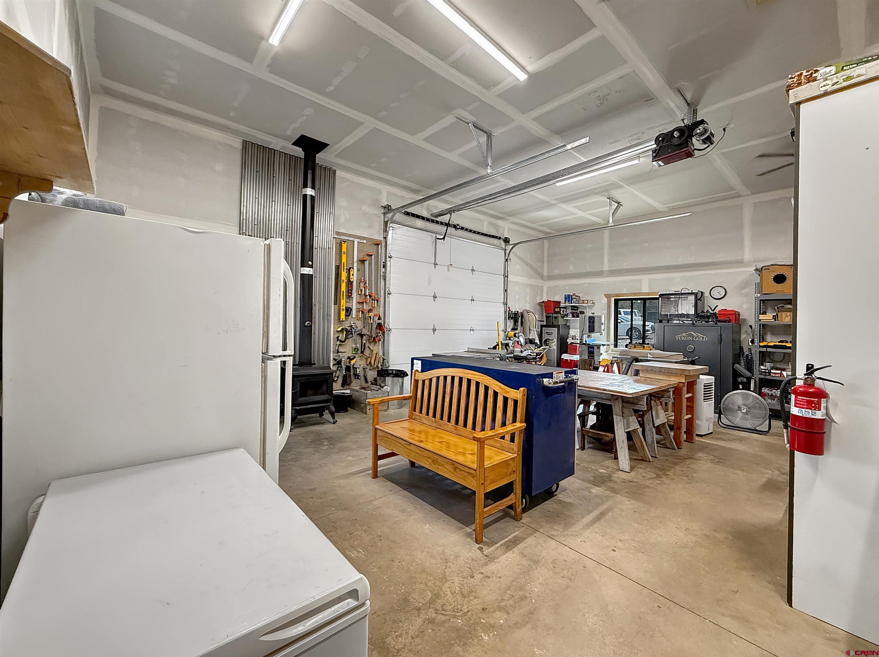 75707 B76 Road Crawford, CO 81415 - Photo 39 of 44 a bedroom with furniture and a chandelier