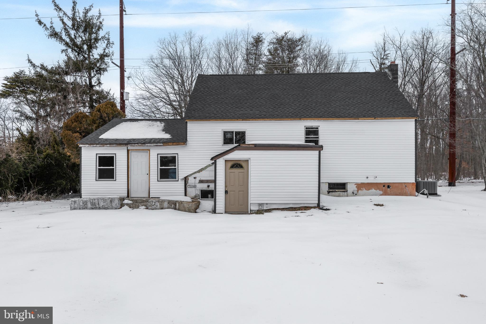 509 Hickstown Road Sicklerville, NJ 08081 - Photo 4 of 6 a front view of a house with a yard and garage