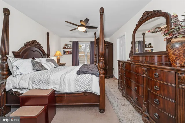 a bedroom with bed and a dresser