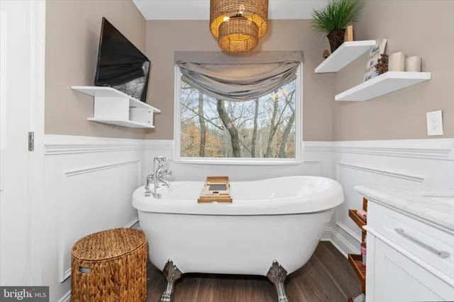 a white bath tub sitting in a bathroom