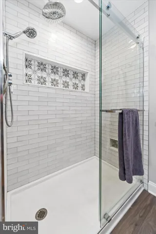 a bathroom with a bathtub and shower