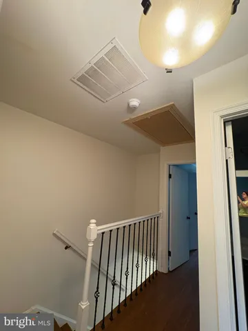 a bathroom with a sink mirror vanity and toilet
