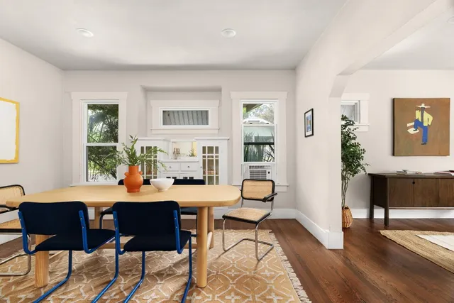 a view of a livingroom with furniture and a potted plant