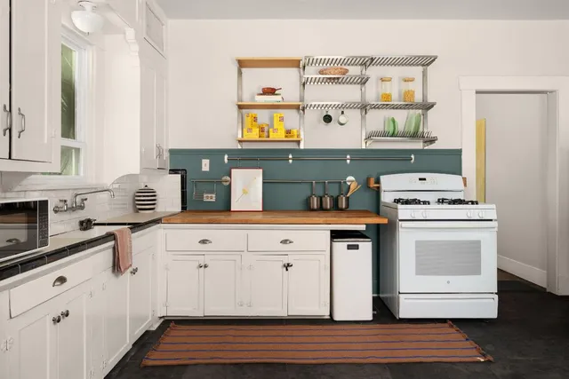 a kitchen with stainless steel appliances granite countertop a stove and a sink