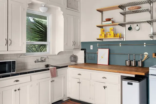 a kitchen with a sink and cabinets