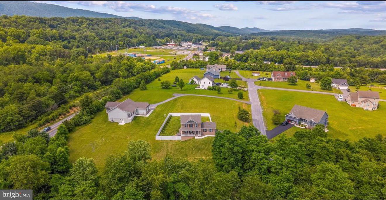 123 Hank Aaron Road Berkeley Springs, WV 25411 - Photo 6 of 32 Serene suburban landscape with hills.
