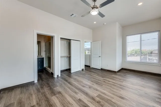 a view of kitchen with stainless steel appliances refrigerator oven and cabinets