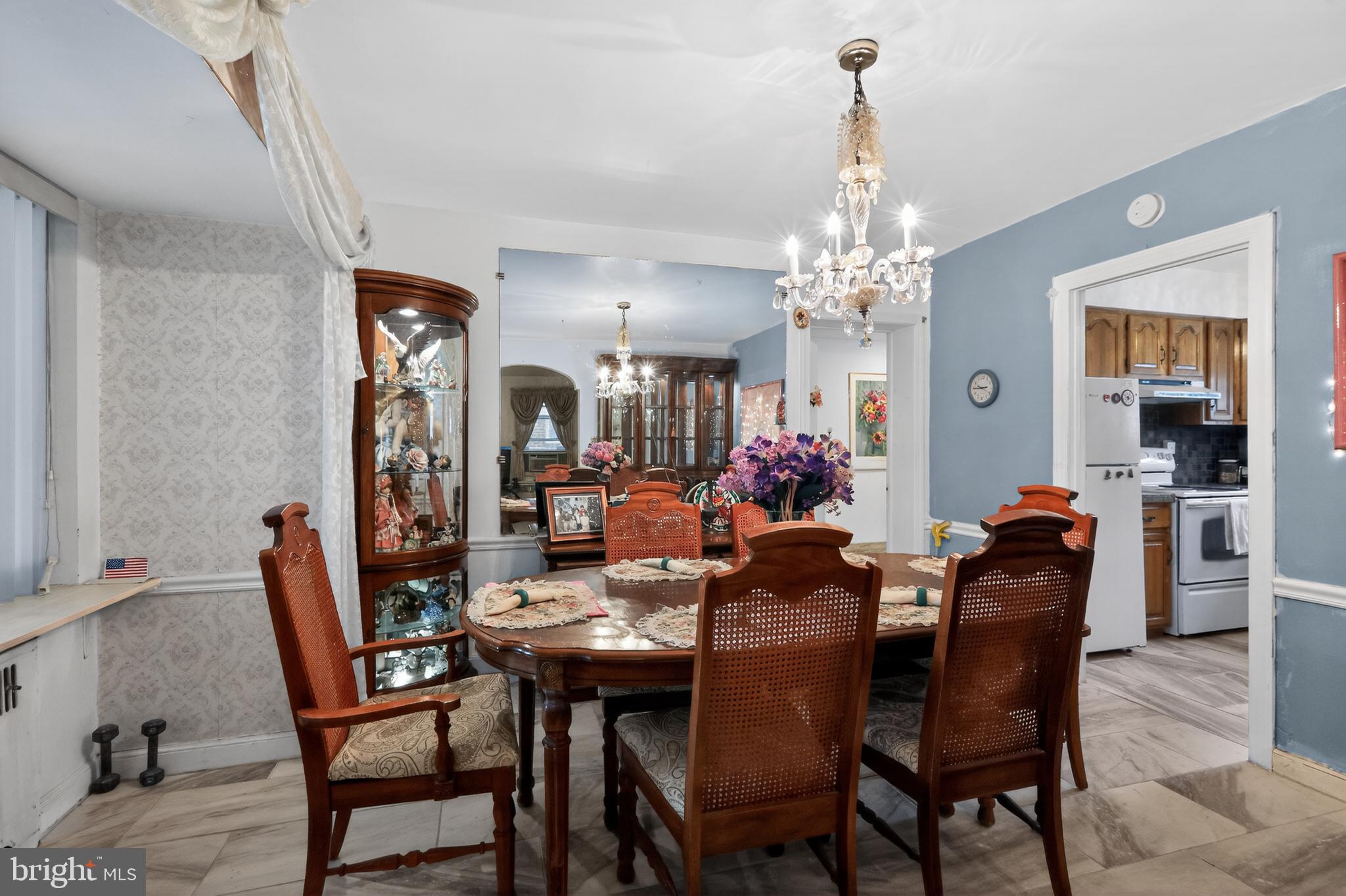 1424 Burmont Road Havertown, PA 19083 - Photo 6 of 37 a view of a dining room with furniture and chandelier