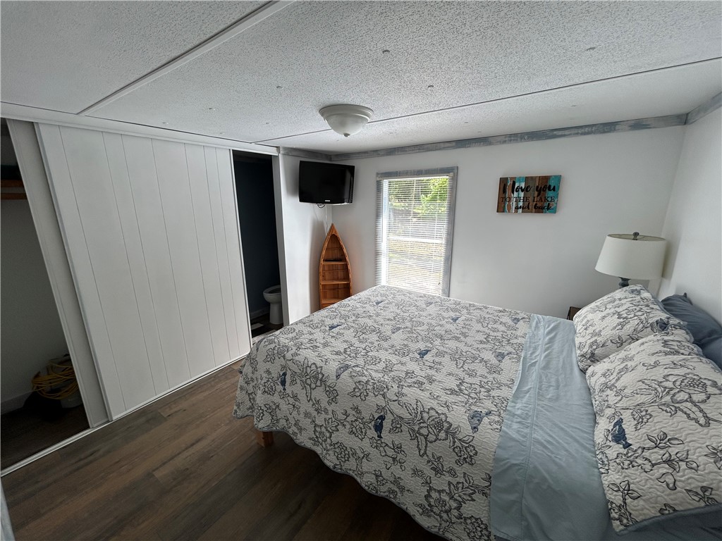 43 Sunset Cove Road Abbeville, SC 29620 - Photo 16 of 41 This cozy bedroom features durable flooring and a window with natural light.