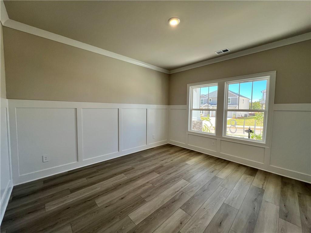2969 Sweet Red Circle Braselton, GA 30517 - Photo 11 of 49 wooden floor in an empty room with a window