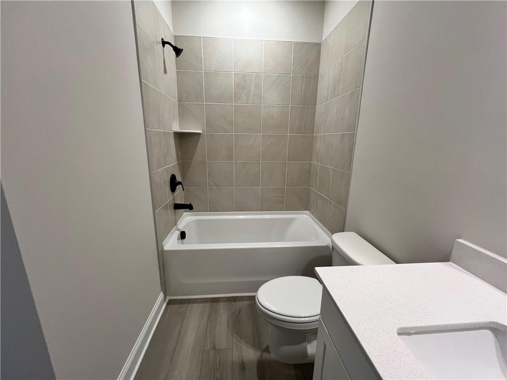 2969 Sweet Red Circle Braselton, GA 30517 - Photo 27 of 49 a white toilet sitting next to a bath tub