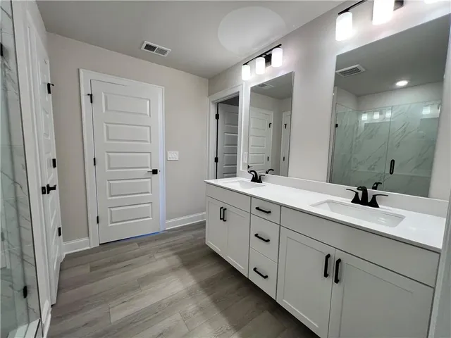 an empty room with a window and a hallway